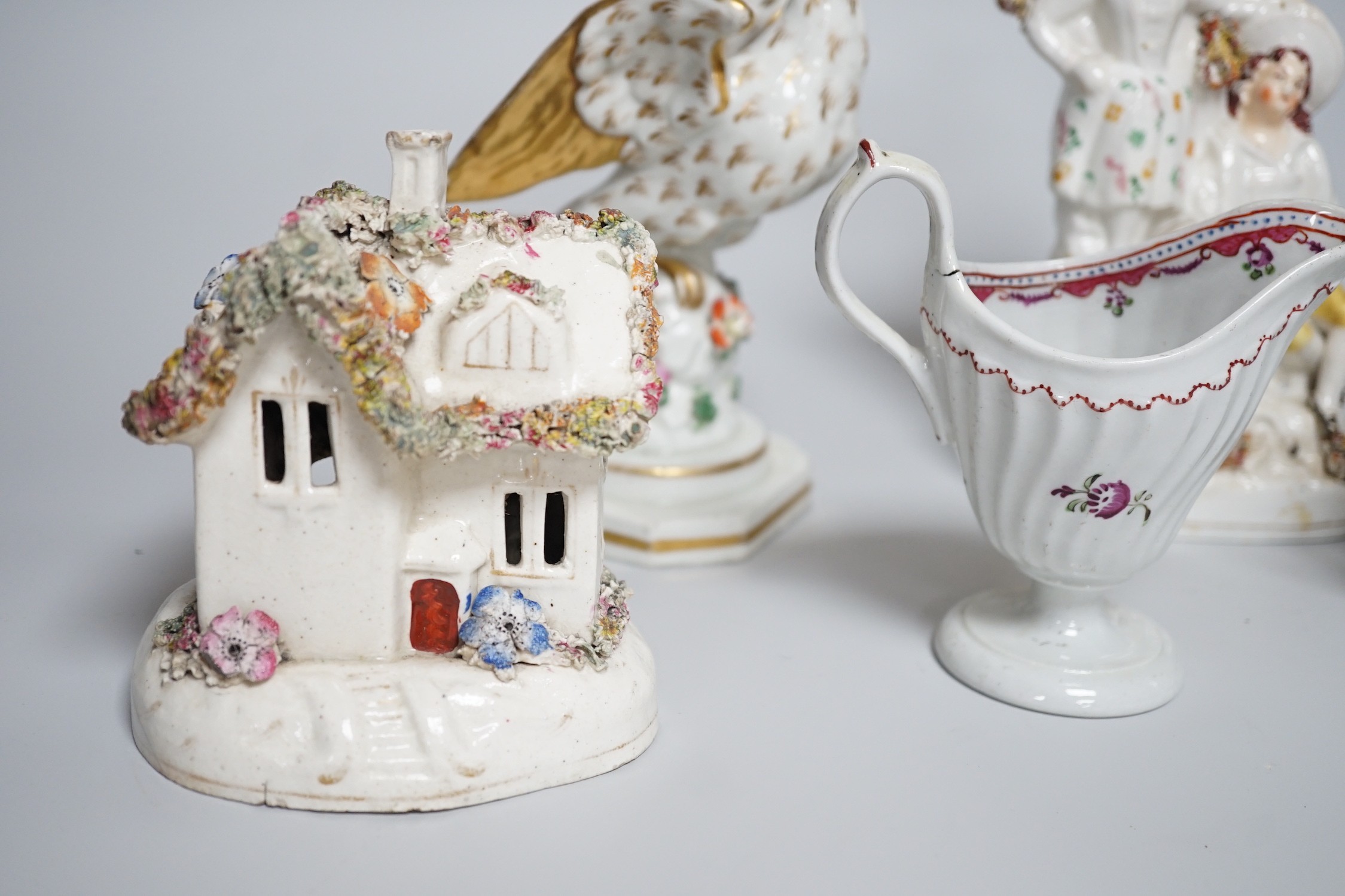 A Worcester milk jug, c.1780, a Newhall-type cream jug, c.1795, a Staffordshire porcelain model of an eagle, c.1830-40, 17cm high, and two Staffordshire porcellaneous models